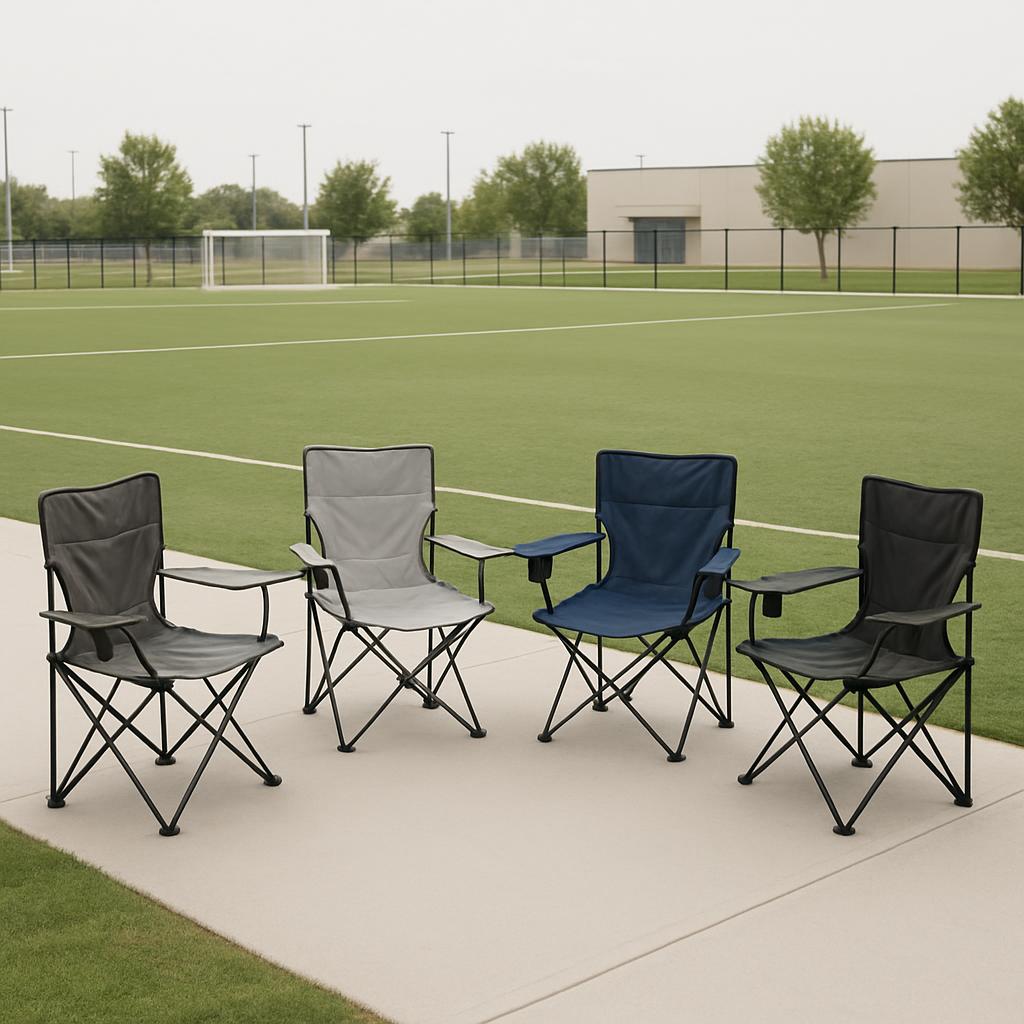 Four camp chairs sitting on an athletic yard.